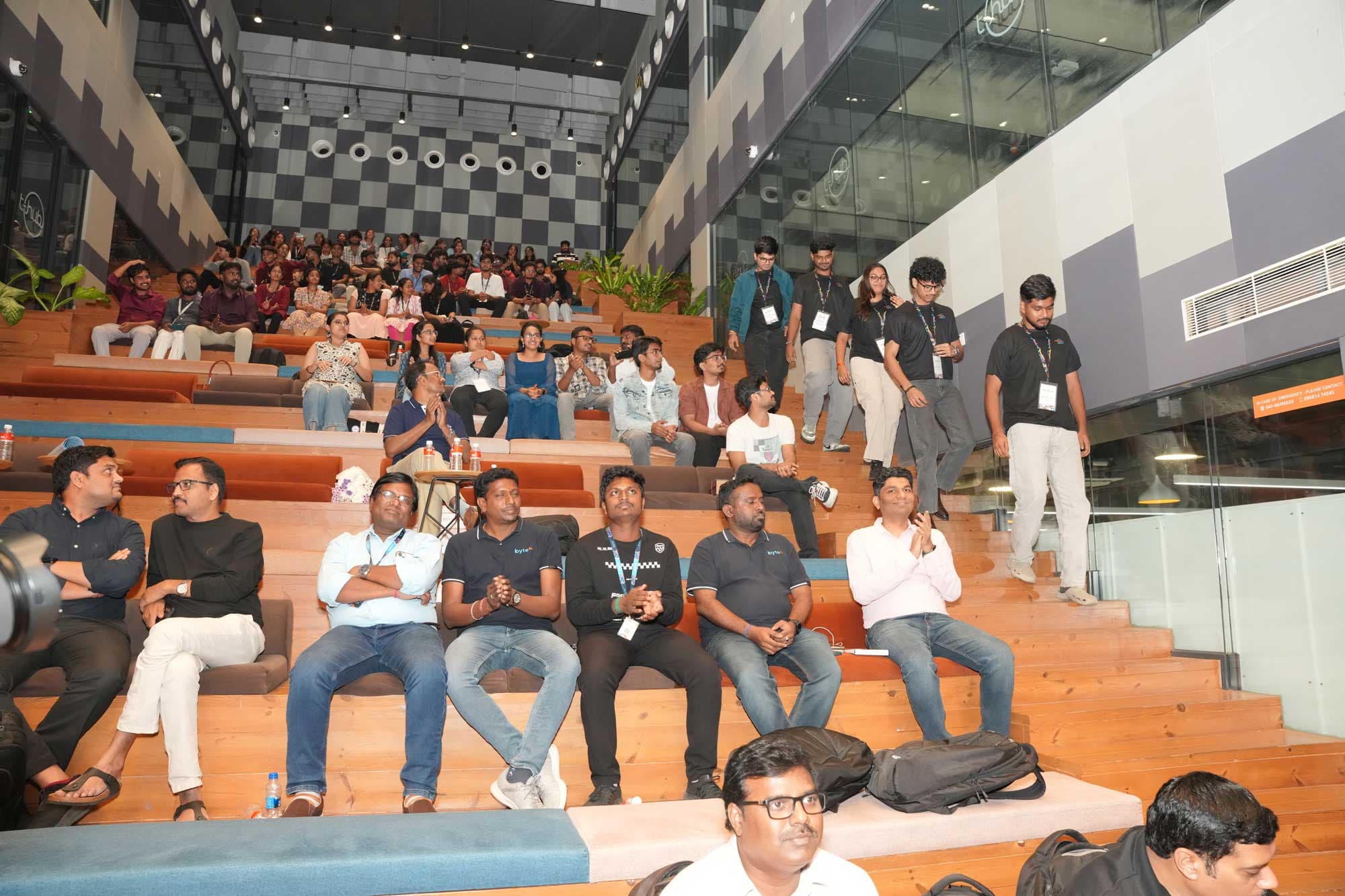 A full house watching the HacXLerate finale from tiered seating