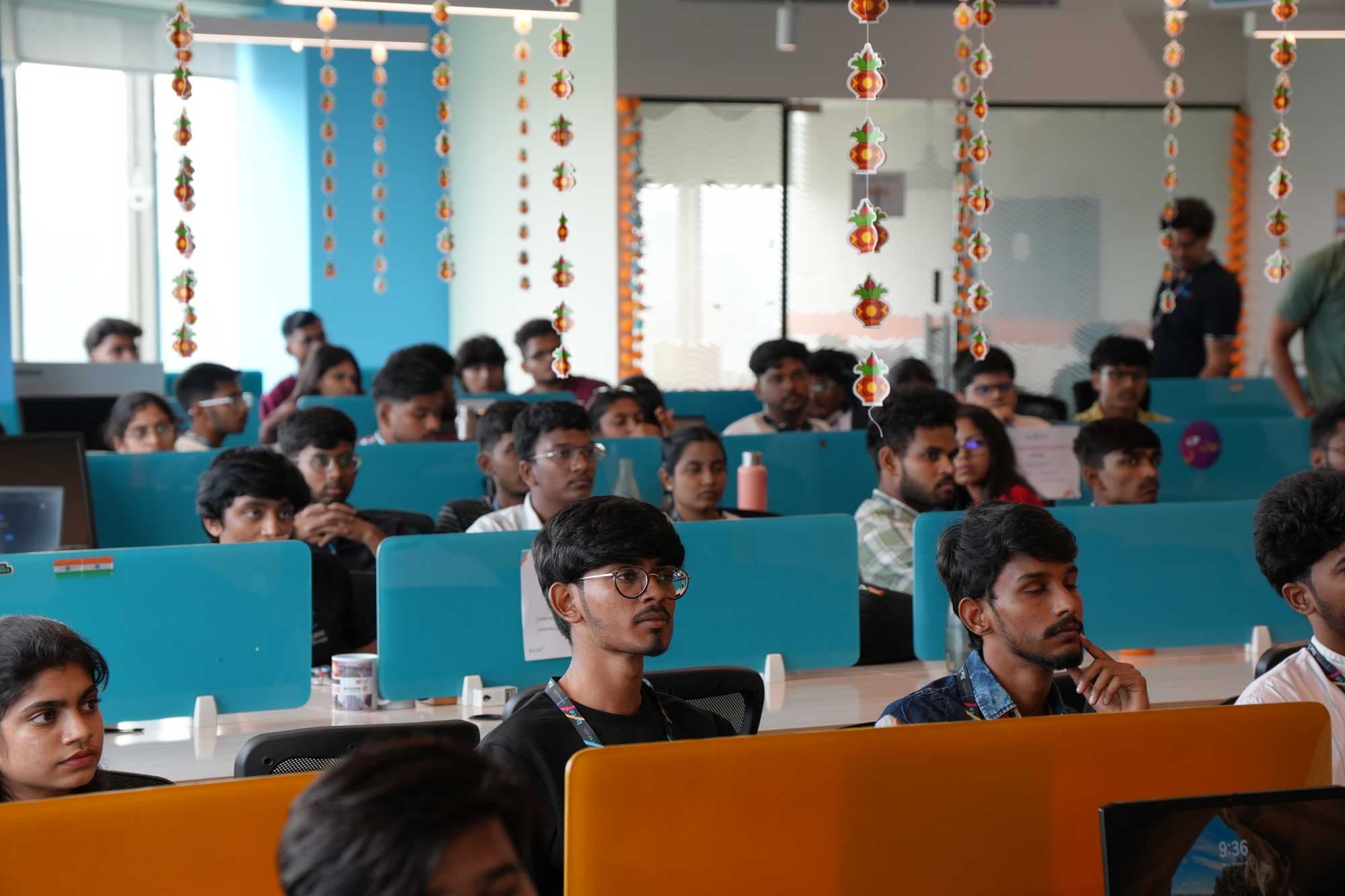 Participants concentrating on their laptops during the hackathon