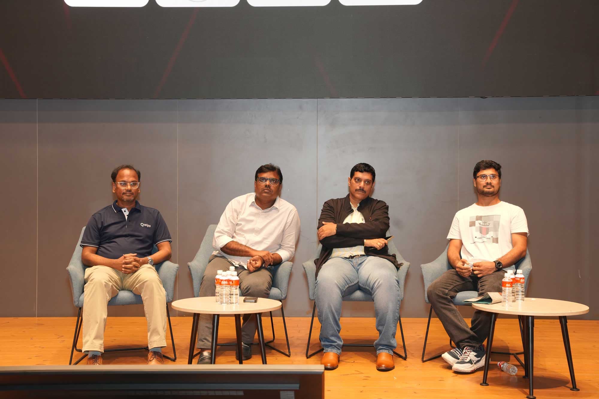 The HacXLerate jury seated on stage