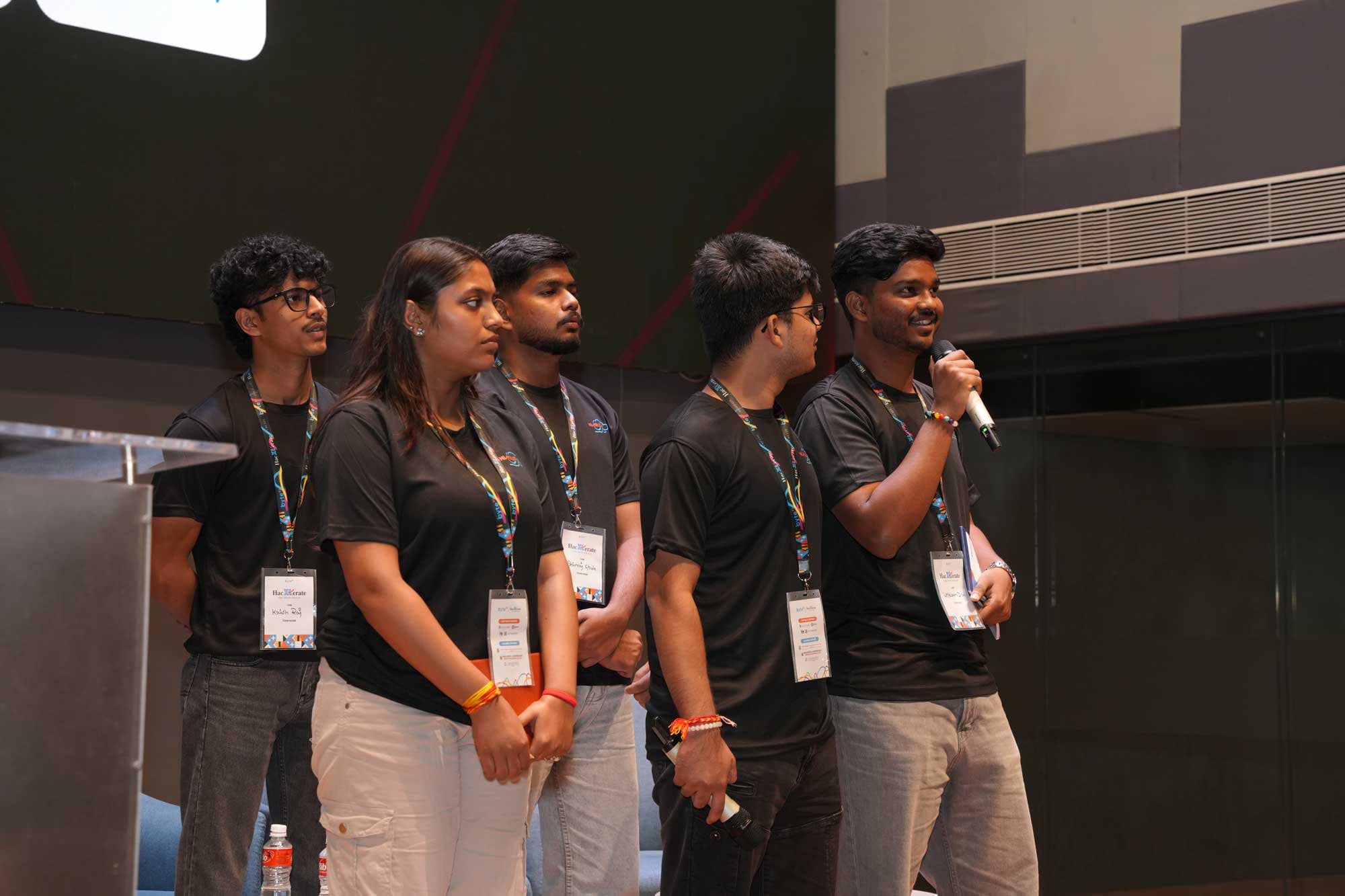 A team presenting their project on stage